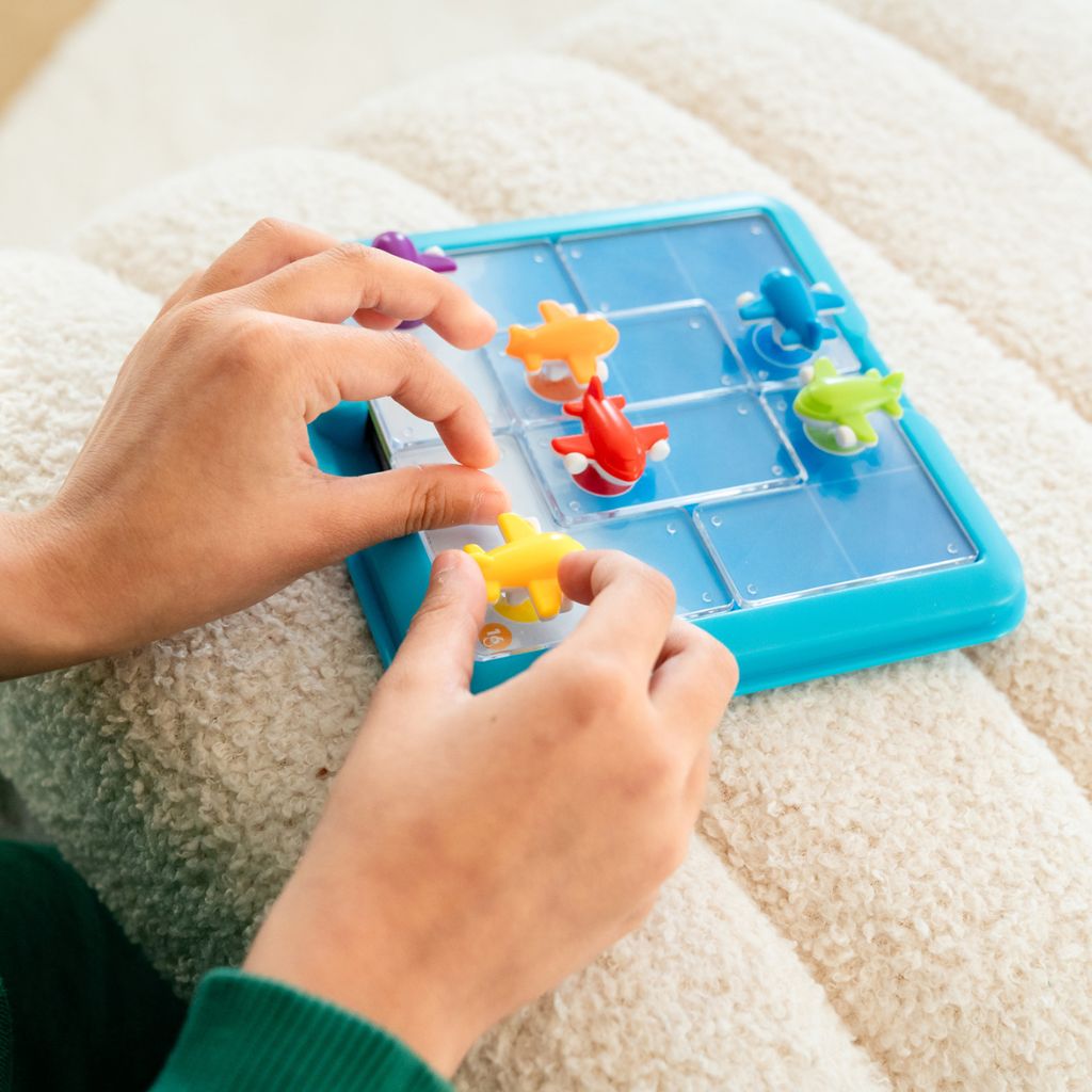 Take Off compact travel case with board, airplane pieces and double-sided challenge cards for play on the go