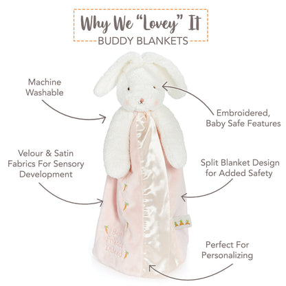 Details of the Blossom Bunny Buddy Blanket: satin trim, embroidered face and carrot tag