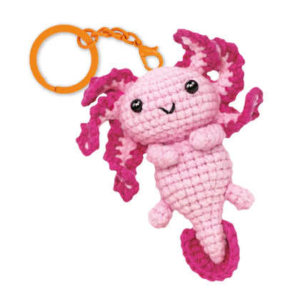 Close-up of the Love Axolotl crochet keychain showing its adorable aquatic character details