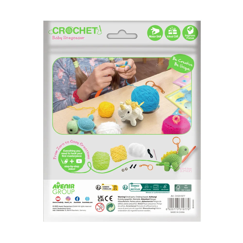 Close-up of the Baby Stegosaur crochet keychain with its cute dinosaur-inspired details