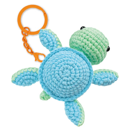 Mint turtle crochet keychain craft kit showing the materials and design for the DIY proje