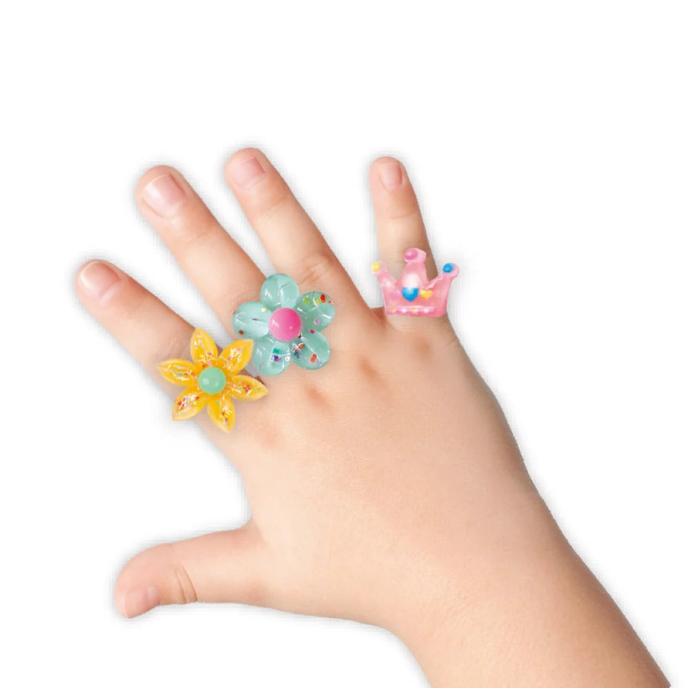 Colourful Avenir sparkle rings from the Yummy Yummy kids jewellery set arranged together for dress-up play