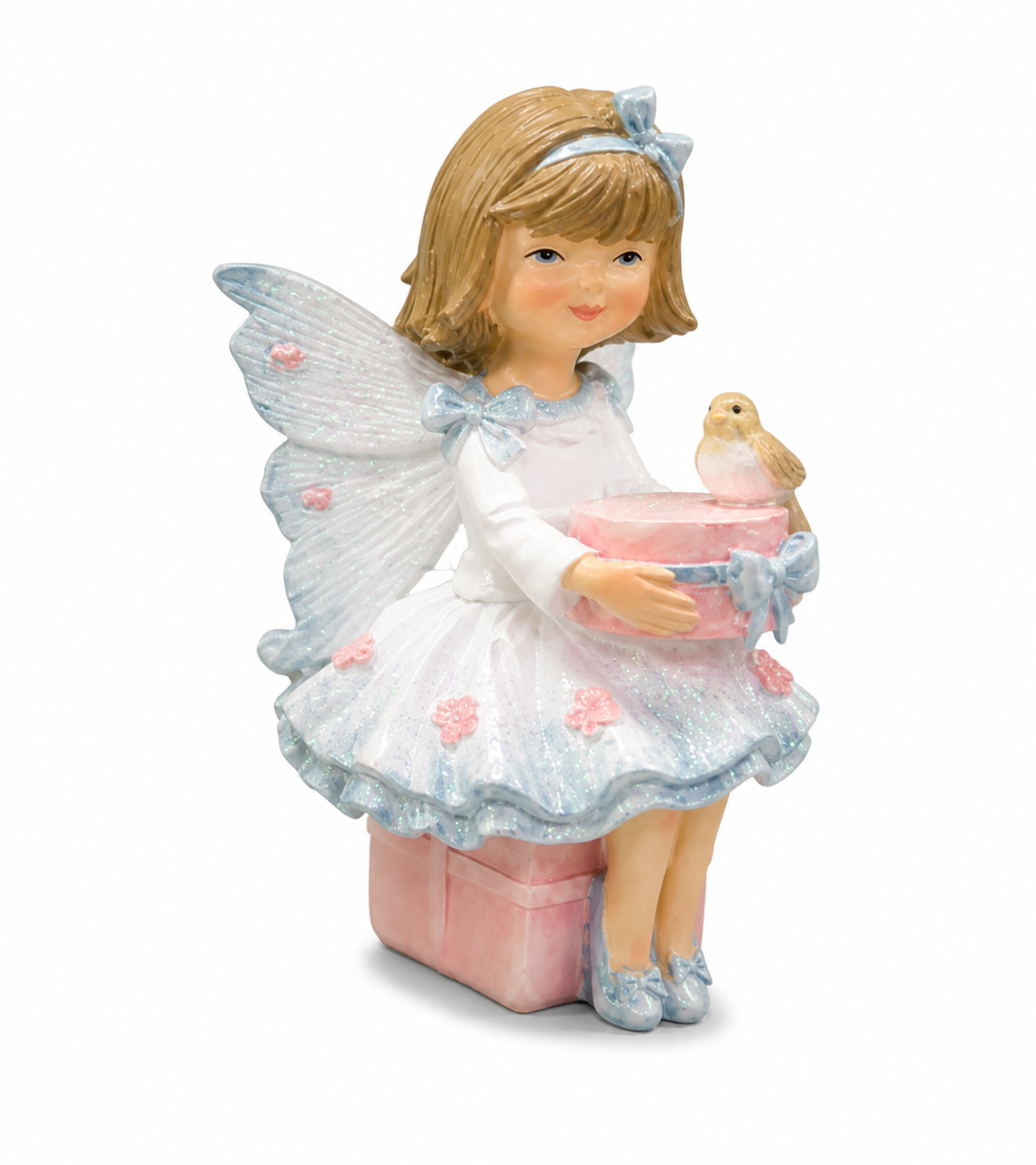 Sitting fairy figurine on gift box holding present with small bird detail