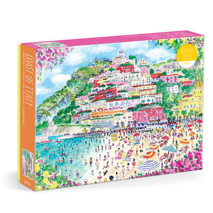 A colorful jigsaw puzzle box featuring a watercolor-style illustration of a coastal town and beach, with the title 'COAST OF ITALY' visible on the side panel.