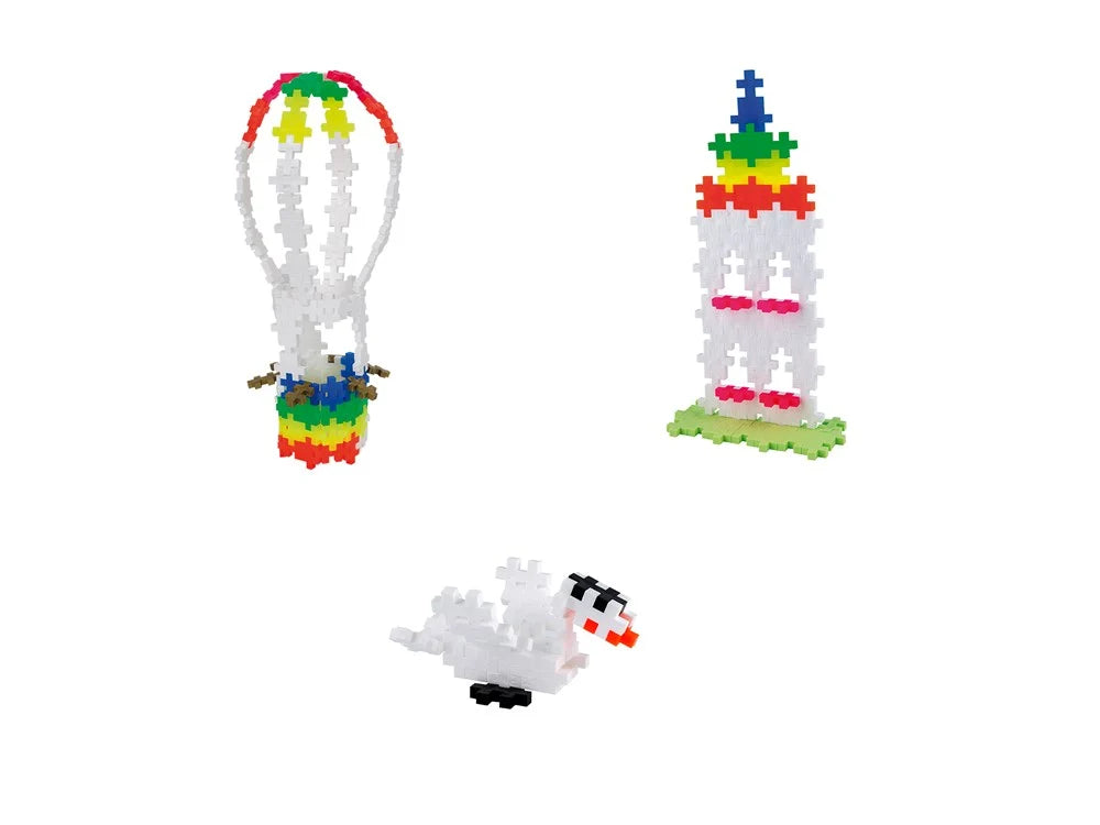 All four builds together: the pastel hot air balloon, rainbow, swan and small figure