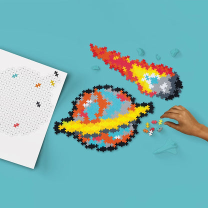 Both finished mosaics from the set: a Plus-Plus planet and a comet, shown side by side