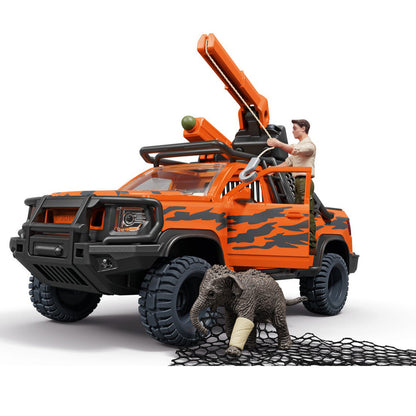 Schleich orange and black toy off-road rescue truck with a crane, shown with a small injured elephant figurine and net. A small human figure is seated in the driver's seat.