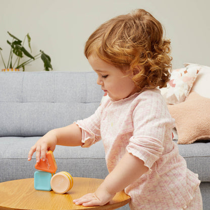 girl playing with shape shakers