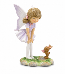 Fairy figurine with bunny in pastel colours standing on garden base