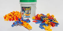 Mobilo Giant Bucket construction set with 416 pieces, shown with red, yellow and blue connectors and geometric shapes beside a small aeroplane model