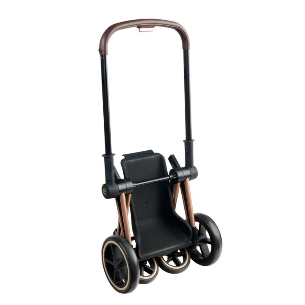 Cybex doll pram with the seat unit reversed so the doll faces the child pushing the pram