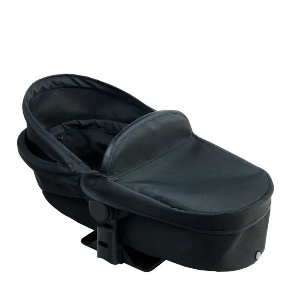 The carrycot from the black Corolle x Cybex doll pram shown on its own, removed from the frame
