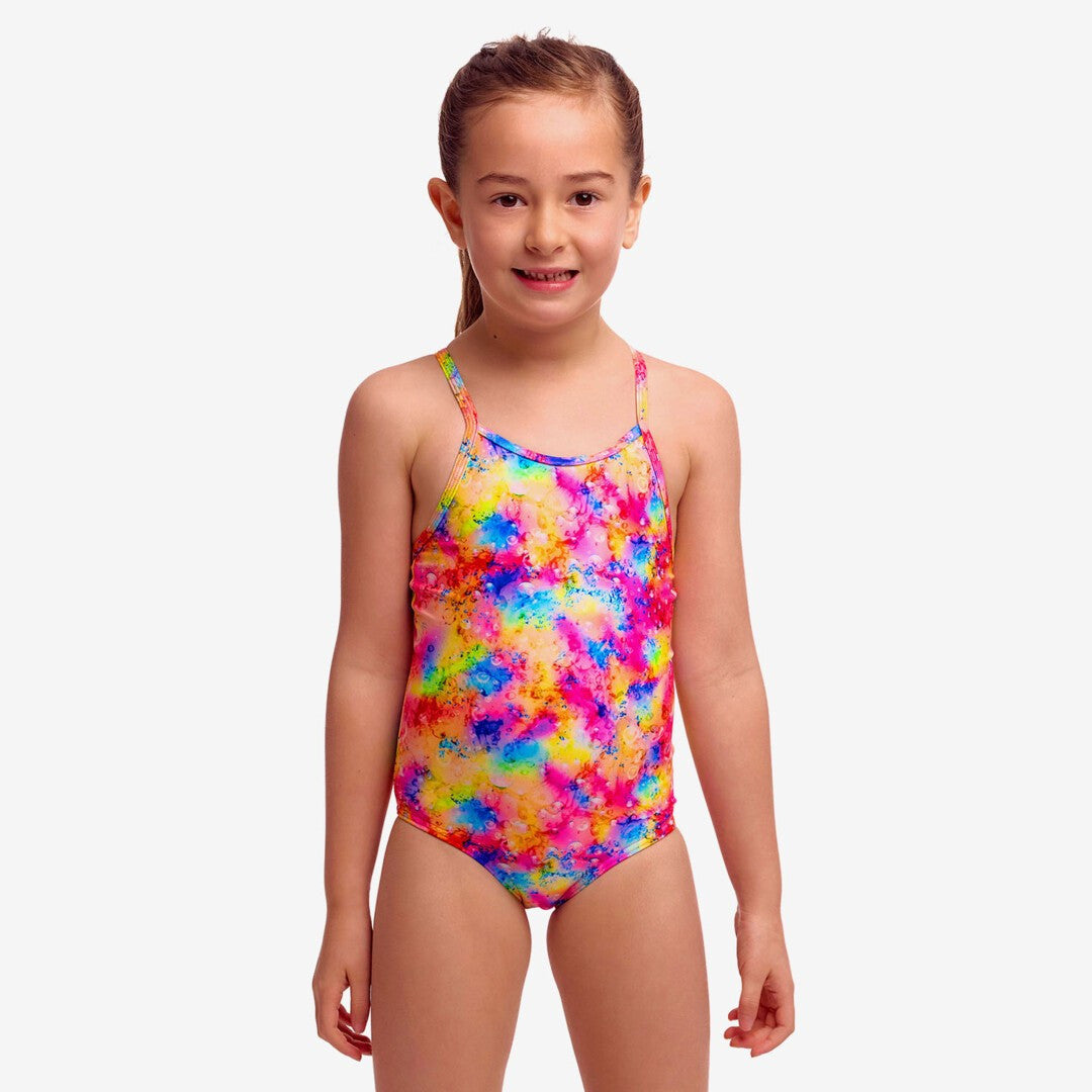 Toddler girl wearing Funkita Dry Me one piece swimmers with colourful rainbow print