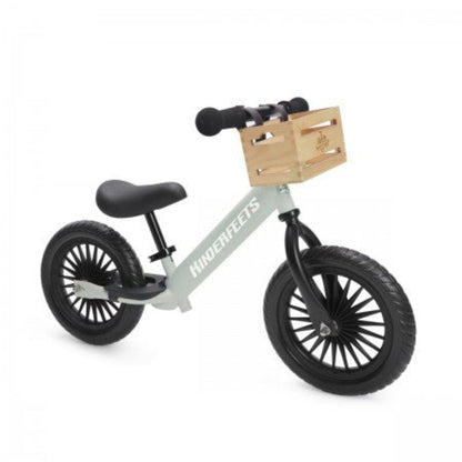Kinderfeets Trail Balance Bike in Silver Sage shown with optional wooden handlebar crate accessory