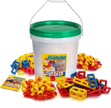Plasticant Mobilo construction set in a white storage bucket with green lid, surrounded by colourful red, yellow and blue building pieces, connectors and instruction booklet.