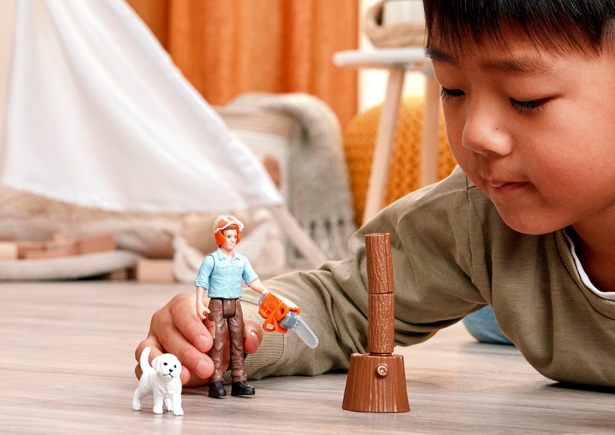 Schleich Forester Pocket Set 81475 with forester figure, puppy, squirrel, chainsaw and firewood accessories