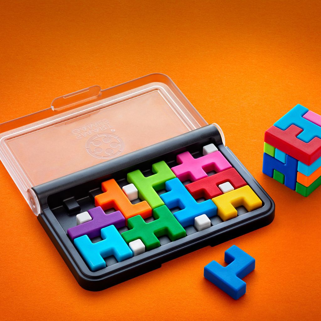 Ten soft-touch IQ Quub puzzle pieces fitted together to fill the game board flat in a 2D challenge